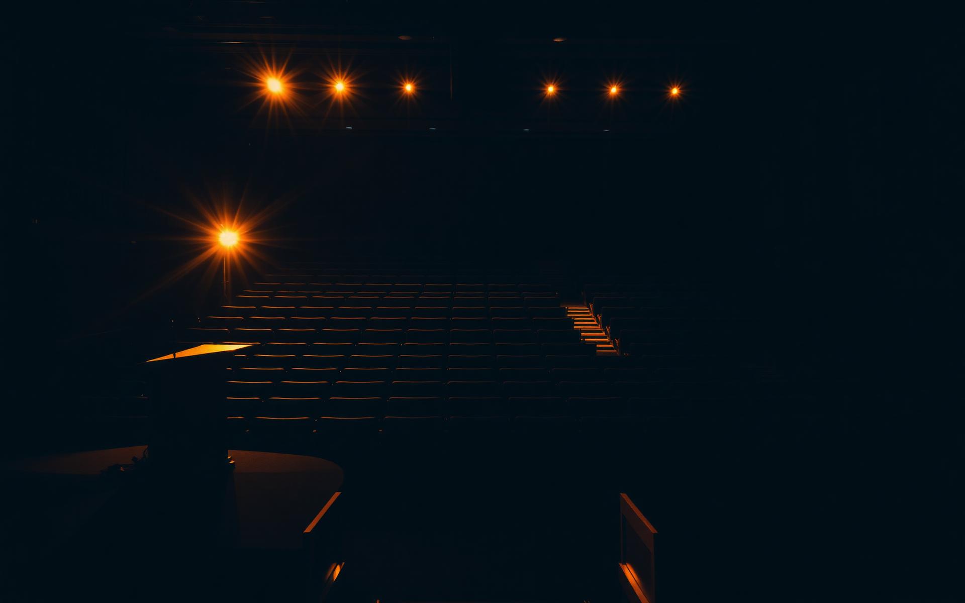 Darkened sanctuary lit by warm stage lights